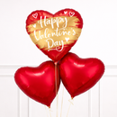 Heart-shaped balloons with 'Happy Valentine's Day' text on a white background